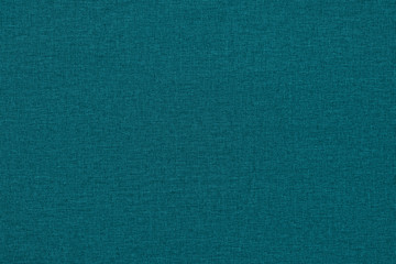 Jade color background with a textured surface, fabric.