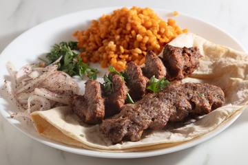 Traditional Adana Kebap with salad