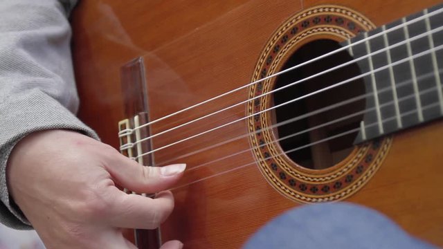 Short shot of the stippling of a flamenco guitarist