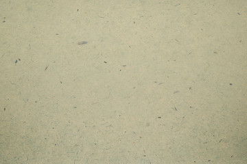 A dense industrial sheet of grey paper with a textured surface