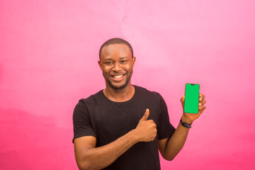 young handsome african man feeling excited about what he saw on his phone