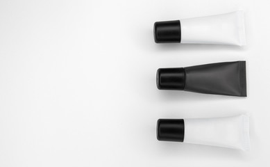 Tubes with cosmetics on a white background.