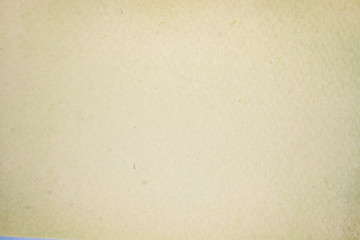 A dense industrial sheet of grey paper with a textured surface
