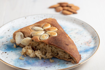 Turkish Perde Pilavi / Drape pilaf with chicken, almond and raisin