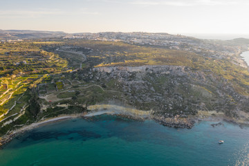 Aerial view of maltese landscape, cliffs. Sunset time. St. Pauls island. Selmun, Malta island