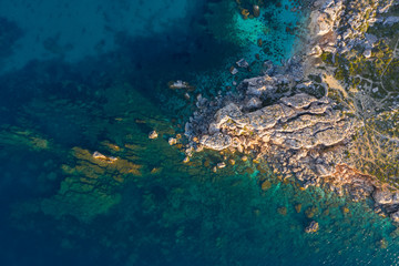 Rocks, cliffs in the sea. Aerial top view
