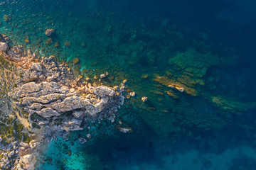 Naklejka na ściany i meble Rocks, cliffs in the sea. Aerial view