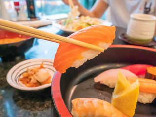Eating Sushi with chopsticks