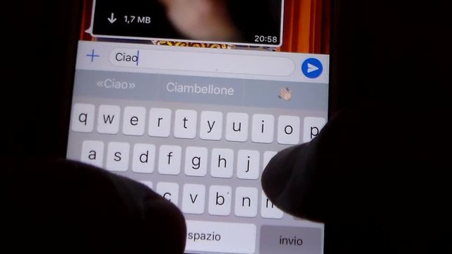 Person chatting with their relatives with the smartphone during the lockdown