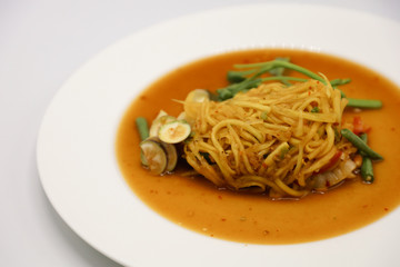 Green Papaya Salad (Som tum Thai) on white background
