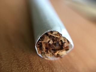 Macro photography of cigarette, Focus point on tobacco inside the cigarette.