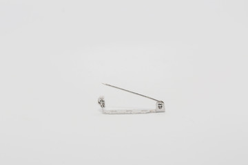 Safety Pins displayed on white background