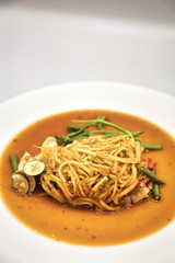 Green Papaya Salad (Som tum Thai) on white background
