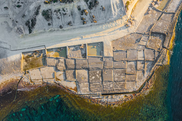 Aerial top view of nature salt pans and sea. Spring in Malta.