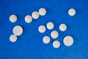 medical pills on blue background