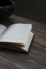 open book on a wooden table