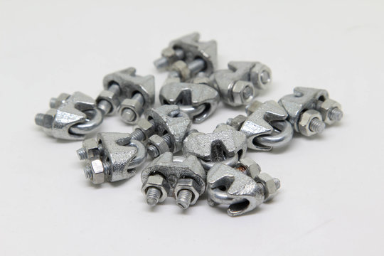 Cable fasteners or wire rope clips on white background.