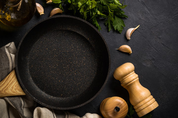 Frying pan or skillet on black table.