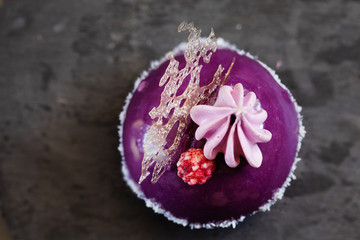 Fototapeta na wymiar Top view of blueberry mousse pastry dessert with decoration copy space