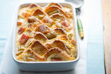 Rhubarb & ricotta bread & butter pudding with icing sugar 