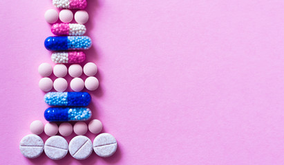 Pills, medicine for pneumonia, antibiotics on an pink background. Coronavirus, MERS-CoV, Wuhan coronavirus 2019-nCoV,concept of Corona virus quarantine,Covid-19.