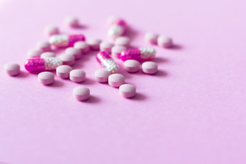 Pills, medicine for pneumonia, antibiotics on an pink background. Coronavirus, MERS-CoV, Wuhan coronavirus 2019-nCoV,concept of Corona virus quarantine,Covid-19.