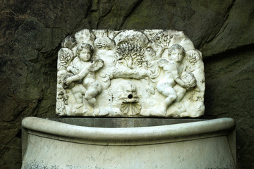 Marble slab with images of angel of bird trees