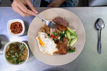Vietnamese broken rice with grilled pork chop, fried egg and meatloaf