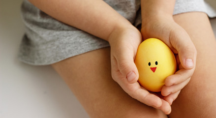 children hands hold yellow chicken, donation and family insurance concept, world health day, foster family adoption