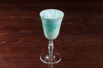 Blue drink cocktail with foam