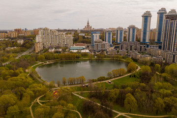 Fototapeta na wymiar residential buildings around the city lake removed from the drone