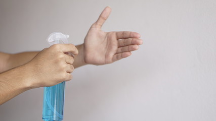 Work from home cleaning hands with alcohol.     