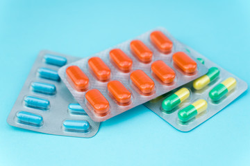 blisters with pills on a blue background