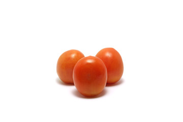 Three tomatoes (Solanum lycopersicum) isolated on white background