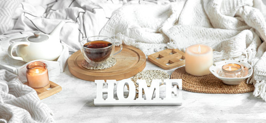 Cozy home still life with a Cup of tea and a teapot.