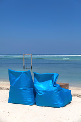 Colored sunbed under the tree in ocean view of Indonesia, Gili Trawangan island. 
