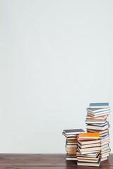 a lot of stacks of educational books for college exams in the library on a white background