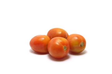 Four tomatoes (Solanum lycopersicum) isolated on white background