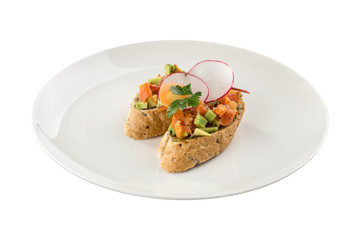 Starter with salmon tartare salad avocado on bread toast bruschetta isolated on white background