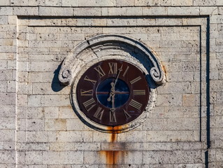 Fototapeta na wymiar Vintage clock on the tower close-up in summer