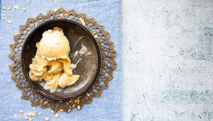 Homemade banana creamy frozen ice cream vegan dessert in bowl. Non diary. Overhead