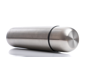 Metal thermos isolated on white background with shadow reflect, close up