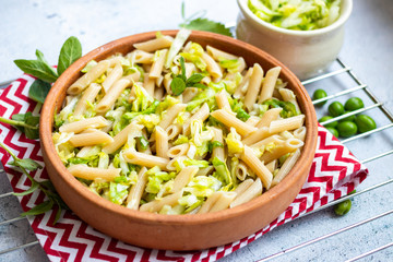Italian pasta or macaroni with greens and vegetables seasoning. Vegan food