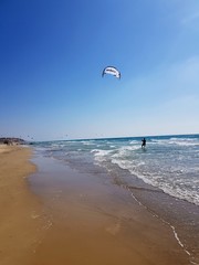 Kite surfer on the beach. Great for relaxing and relieving tension. This image have token with Samsung galaxy s8+ ! ! :) The photographer is 15 years old =)