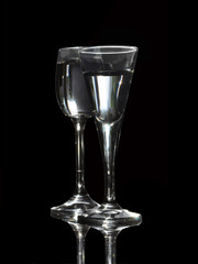 Glasses with a drink close-up on a black background