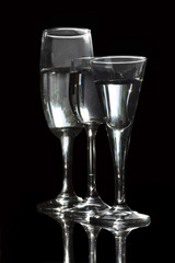 Glasses with a drink close-up on a black background