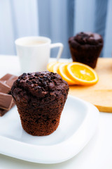 Chocolate muffin with chocolate for breakfast.