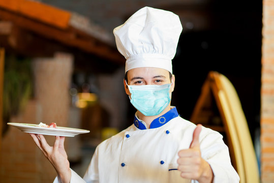 Confident chef wearing a mask - coronavirus concept