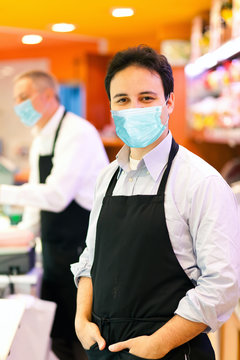 Grocery Storekeepers Wearing A Mask - Coronavirus Concept