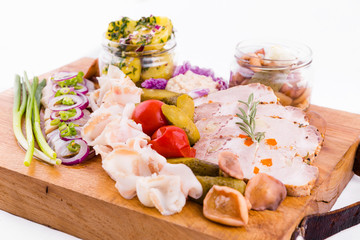Russian traditional snack on a wooden board on a white background